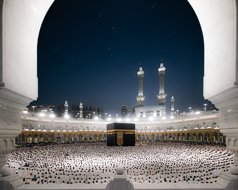 Masjid al-Haram at night during Ramadan, the courtyards filled with worshippers
